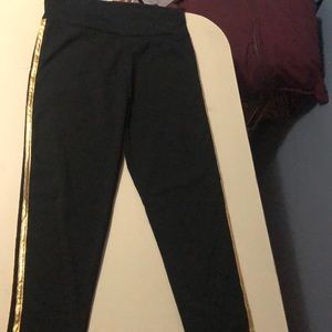 Black with gold stripe leggings size S/M